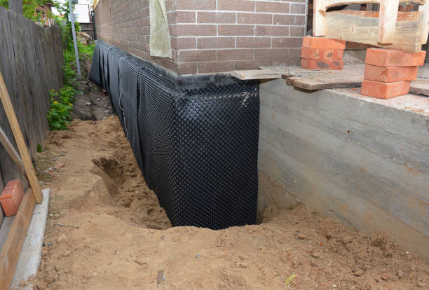 SJ Waterproofing Pros technician performing targeted Interior Drainage System assessment in Amherst, WI